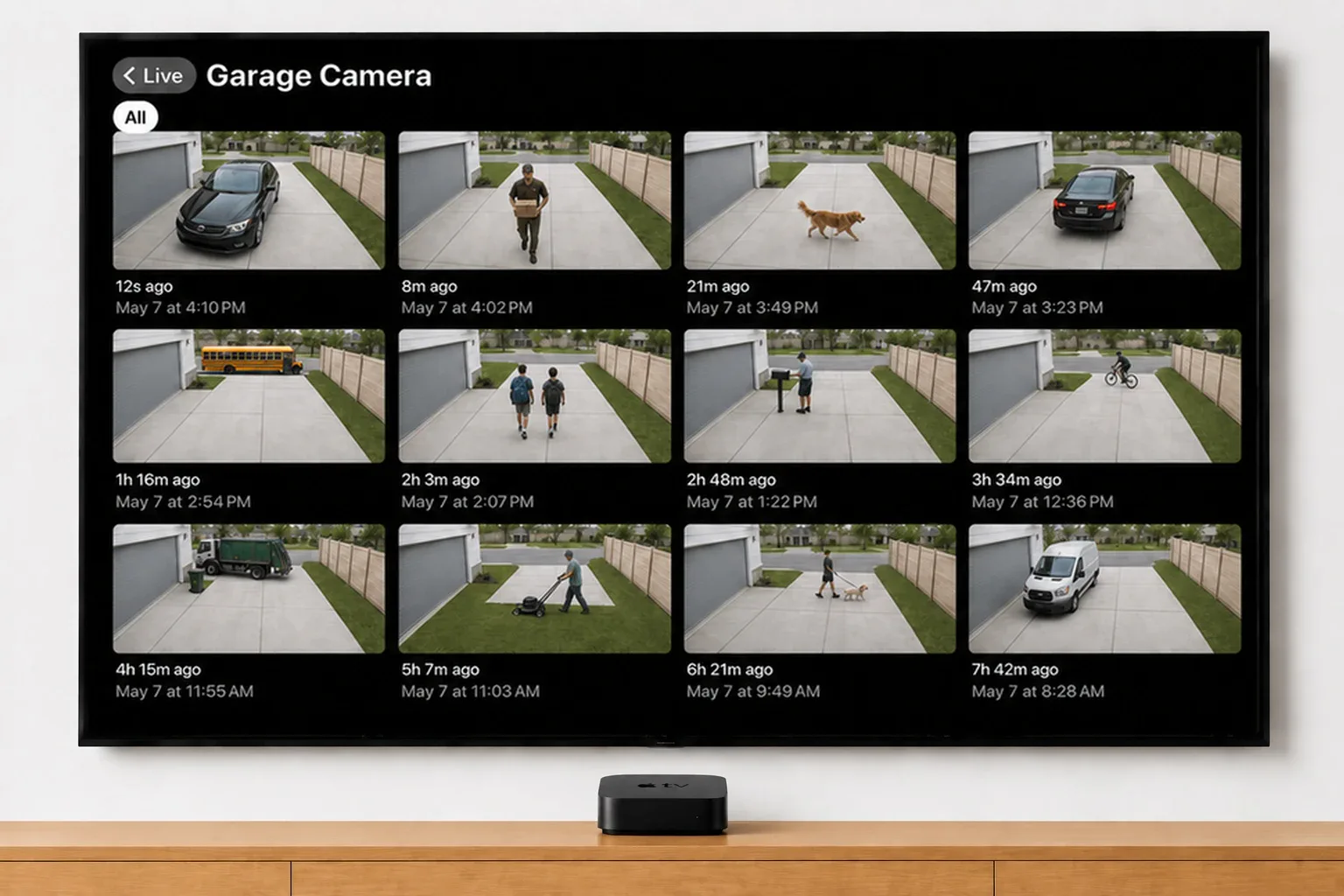 Twelve timestamped Ring motion clips for a Garage Camera on a TV — a delivery, a dog, the school bus and a passing cyclist