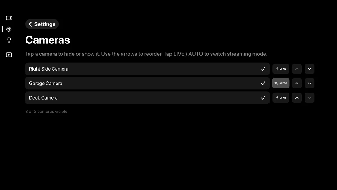 The same settings screen with Garage Camera now showing an AUTO badge while the other two stay on LIVE